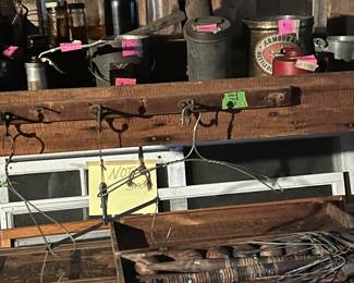 Antique tins including moonshine tools.