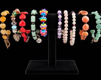 Vibrant Beaded Bracelets on Velvet Stand