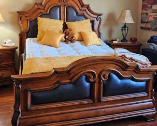 Leather & Wood King Bed with several matching pieces...nightstands, dresser and mirror, and tall  bureau. There is a leather and wood bench that has 2 drawers and shelving underneath.
