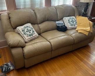 Leather sofa with reclining ends