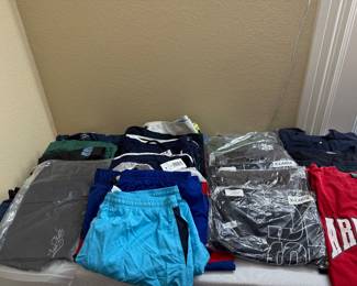 New T shirts, athletic shirts and swim shorts