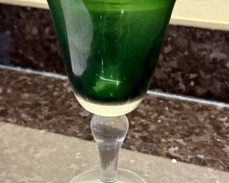 Set of green and clear stemmed water glasses