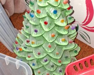 two electric ceramic christmas tree decors with lightbulbs