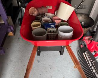 Red Wheelbarrow with Assorted Garden Pots