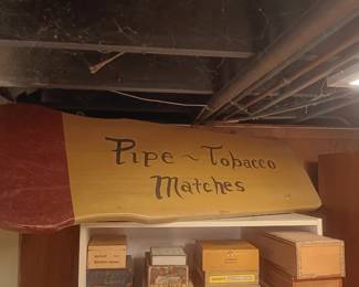 wooden sign, pipe, tobacco, matches