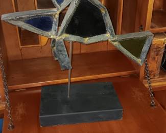 brutalist metal and glass fish sculpture