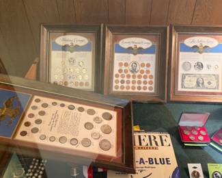 The three framed pieces along the back of this case are sold as a set, and we have three sets