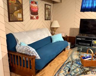 all furniture in basement must go. priced to sell. futon, chrome and glass coffee and end tables