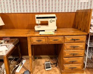 Kenmore sewing machine table, with manuals and attachments