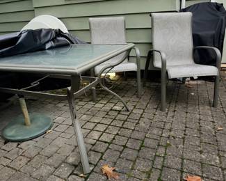outdoor table and 6 chair, two swivel 4 are stackable, umbrella not pictured