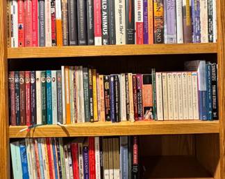 Three Shelves Of Books From Modern To Classic Fiction