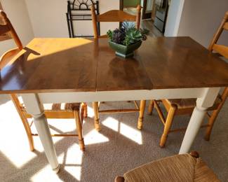 Oak table with self storing Butterfly leaf, also coming with 4 woven rush seats. Dimensions : 39 w x 29 d x 29 h.  Asking $240. Will entertain offers.