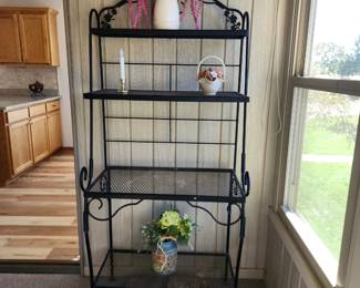 Wrought Iron Bakers rack/plant stand. 4 shelves. Dimensions : 32 w x 68 h x 18 deepest shelf depth.  Asking $70. Will entertain offers