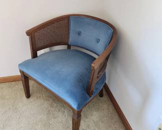 Barrel back chair with beautiful blue upholstery and caining. Dimensions : 25 w x 16  d x 17 h. Seat is 16in from floor. Asking $100. Will entertain offers 