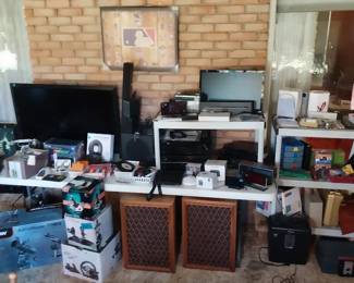 first alert safe, Wi-Fi camera, Pioneer stereo system, Yamaha stereo system, Magnavox VHS/DVD player, Sony DVD, Vizio TV, alarm clocks, Hisense soundbar, vintage telephones, game controllers, Celestron telescope, First act guitar and amps, xylophone