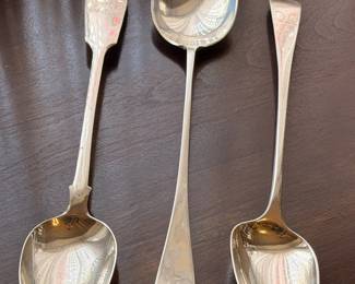 Three large sterling silver serving spoons