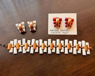 Ca. 1950’s Matisse by Renoir “Peter Pan” pattern enameled copper earrings and bracelet. The white earring will be sold as a set with the bracelet