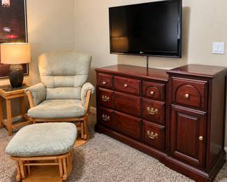 Glider chair with matching ottoman. Solid wood baby changing dresser with diaper storage. Boys room full of all clothes sizes and seasons.