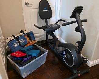 MERACH recumbent exercise bike with backrest and digital console.