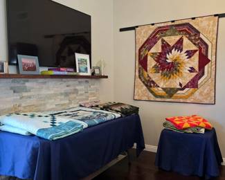 Cathy Farris’s handmade quilt collection includes wildlife panel quilts, traditional patchwork, and a striking star medallion wall hanging in rich autumn colors.