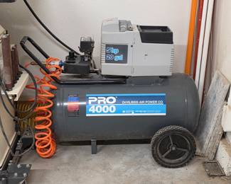 DeVilbiss Pro 4000 portable air compressor with wheeled tank.
