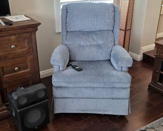 Light blue power lift recliner with textured fabric upholstery and wired remote