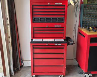 Craftsman rolling tool cabinet with stacked tool chests and drawer storage.