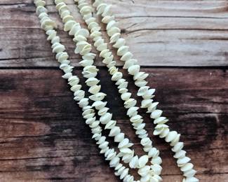 Layered shell necklaces with creamy white tones and natural texture—coastal accessories among the sale’s fashion jewelry selections.