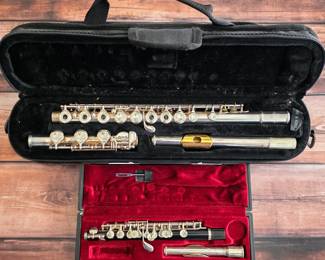 Yamaha sterling silver open-hole flute and Yamaha piccolo, each with a fitted case.
