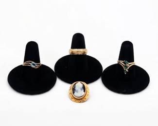 Gemstone rings, a textured gold band, and an ornate cameo—part of the newly added fine and vintage jewelry collection at our Yorba Linda estate sale.