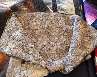 Deep-plush Minky backing on a handmade wildlife cuddle quilt. The long, textured pile adds luxurious softness, while stitched patterns and finished binding remain clearly visible.