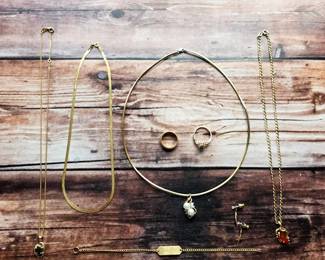 Fine gold jewelry, including chain necklaces, bracelets, rings, and pendants. The sale’s confirmed gold collection includes 10k, 14k, and 18k pieces.