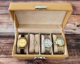 Wristwatch collection including a Tissot Seastar automatic and Timex Indiglo.