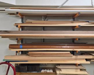 Various species and lengths of lumber, trim, and plywood sheets.for woodworking projects