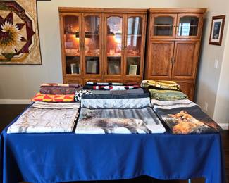 Handmade quilts from Cathy’s collection, featuring detailed quilting, patchwork and wildlife designs.