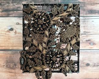 Vintage metal textile-printing stamp with detailed bird and floral motifs.