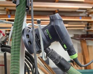 Festool PRO 5 LTD random orbital sander with dust-extraction hose.