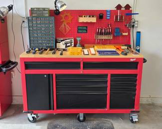 Milwaukee rolling workbench and tool storage cabinet with wood worktop.