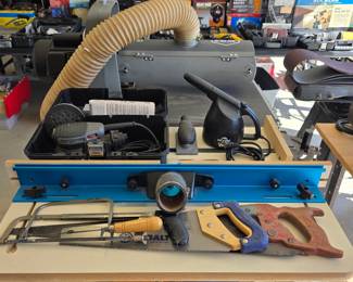 Collection of woodworking hand saws, power tools