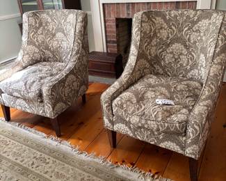 A pair of vintage upholstered swoop-arm accent chairs