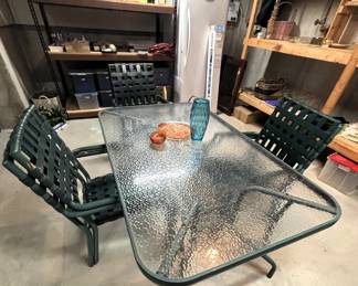 Glass top patio table with six chairs.