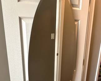 Oval door mounted mirror.