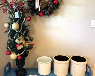 Blue garden bench, crocks, Christmas tree and wreath.