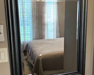 Framed mirror.