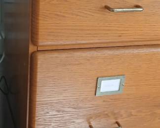 Wood type filing cabinets. Two drawers each. Four sets available