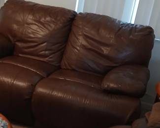 Terrific leather loveseat which reclines. 66 in long. Large sofa that matches. From Kane's furniture.