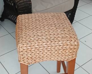 Different types and sizes of barstools and wicker-look chairs.