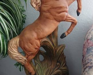 Horse art pieces plus toy horses.