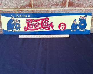 A16 - $75. Pepsi-Cola drink five cent metal sign. Measures 22“ x 5.25“. This sign has a few small scratches. Otherwise in good, vintage shape.