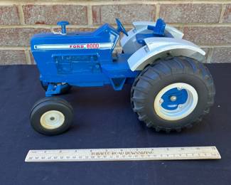 A97 - $50. Ford 8000 Tractor Toy. Measures 12“ x 8“. In good shape.